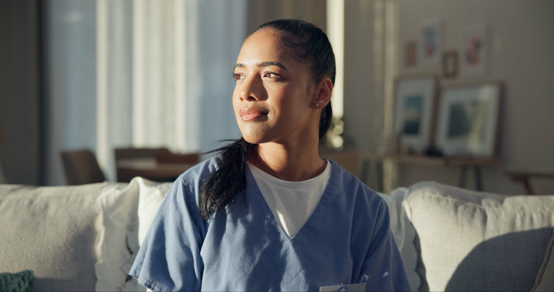 A nurse providing calm support in a comfortable home setting